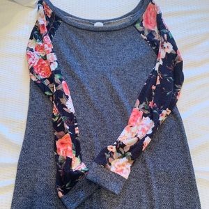 Long sleeve shirt with flower sleeves.